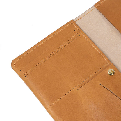 Geometric Goods' smart and trackable AirTag passport holder, made from premium light brown Italian leather