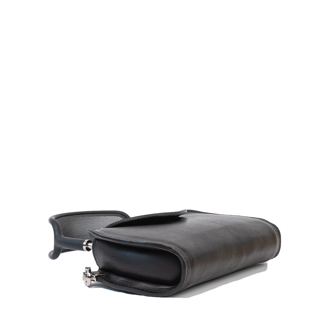 AirPods Max Case in sleek grey leather, open to reveal the perfectly molded compartment for securely storing Apple's headphones