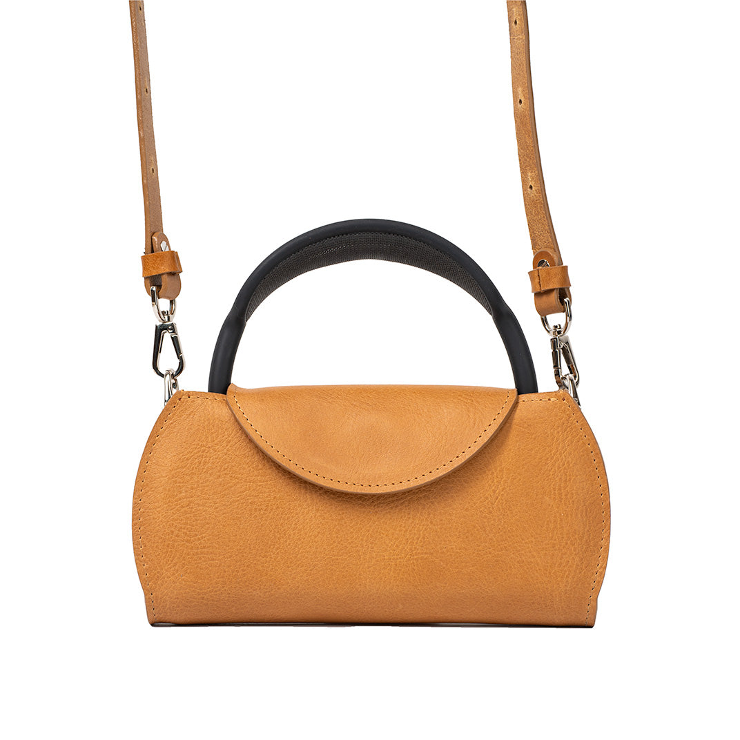 AirPods Max Case in stylish camel leather, featuring both a handle and a crossbody strap for versatile carrying of Apple's headphones