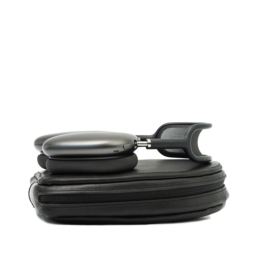 AirPods Max partially resting on their black leather case, demonstrating the case’s fit and the headphones’ stylish design, ideal for users who value both protection and elegance in their accessories