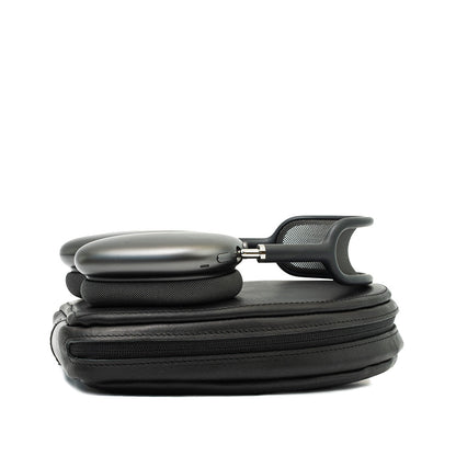 AirPods Max partially resting on their black leather case, demonstrating the case’s fit and the headphones’ stylish design, ideal for users who value both protection and elegance in their accessories