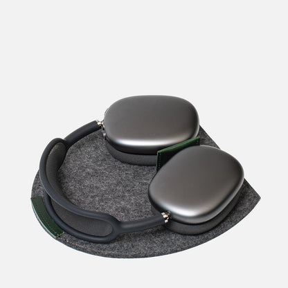 Felt Rest Station 2.0 for AirPods Max — grey 100% Merino wool felt with forest-green leather insert, magnets trigger Low Power Mode; non-slip base, desk dock