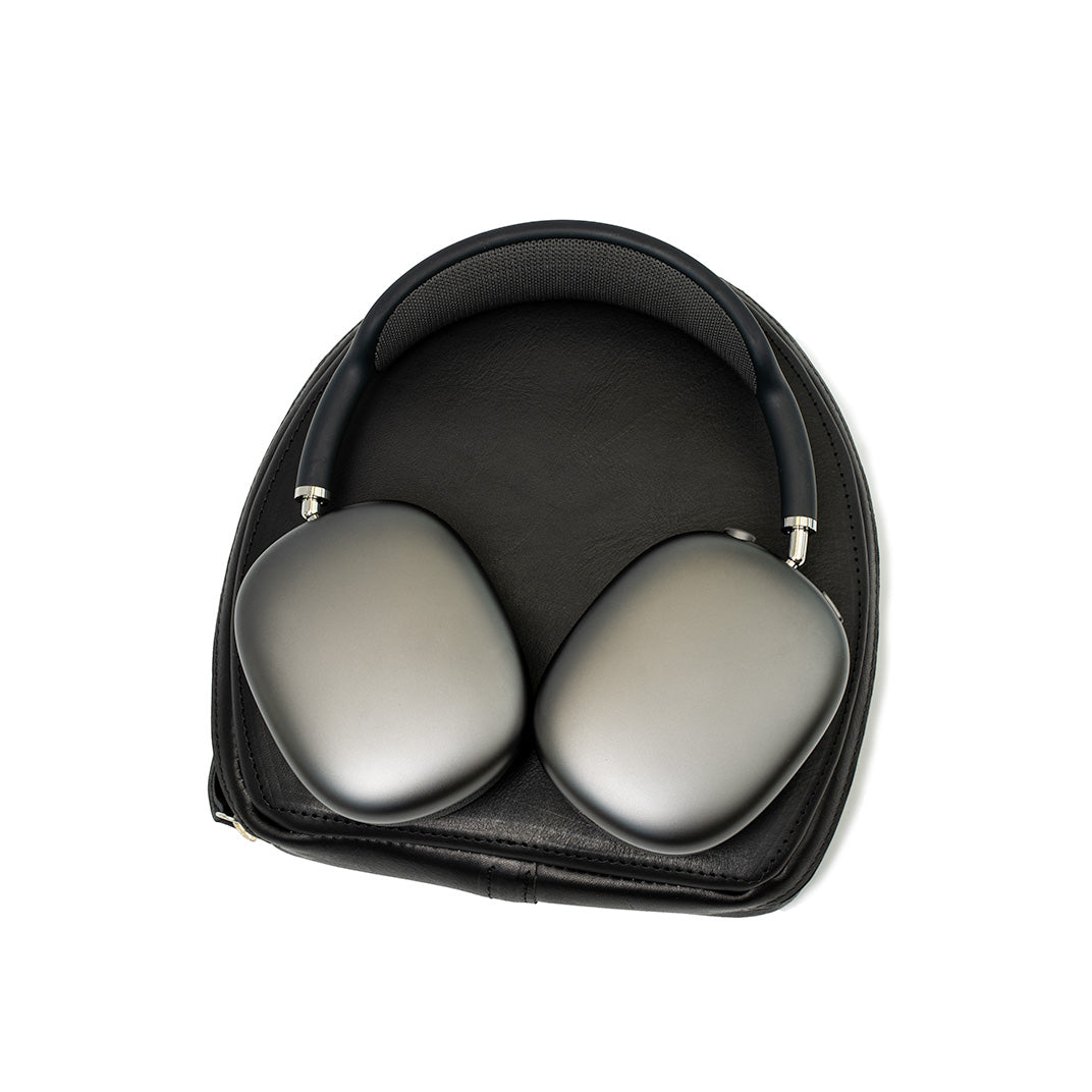 AirPods Max stored in a protective black leather case, showing the headphones nestled securely with a padded interior and zippered enclosure, ideal for safeguarding and maintaining the headphones' pristine condition