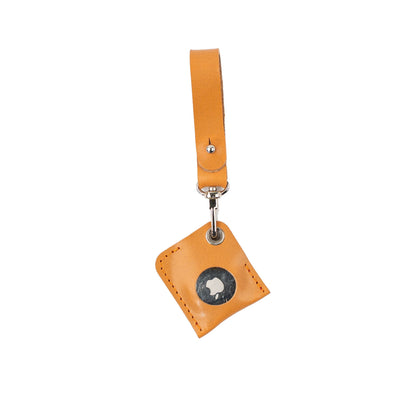 Orange leather AirTag bag charm with a loop strap, silver-tone clasp and stitched holder.