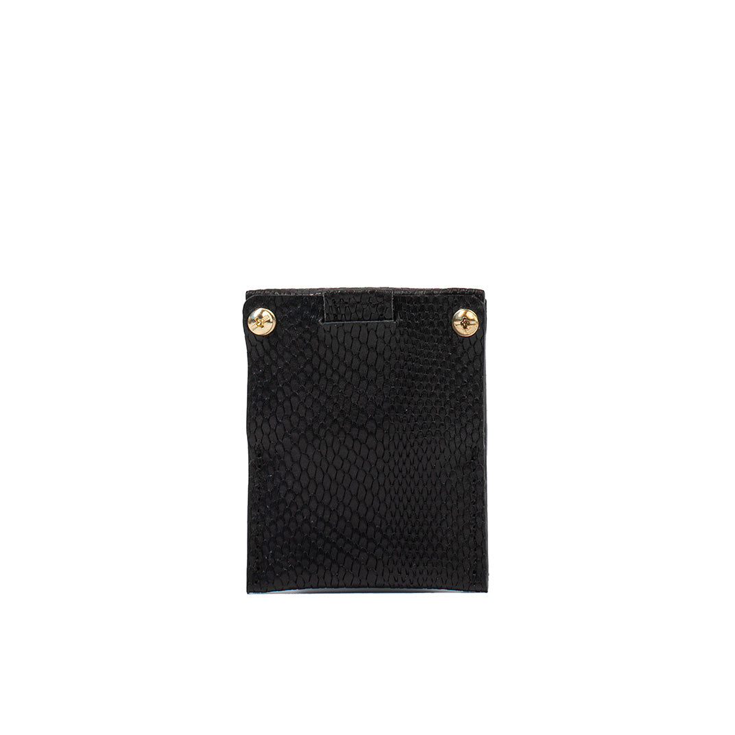 Geometric Goods black snake print leather AirTag card holder with gold rivet details, combining style and security
