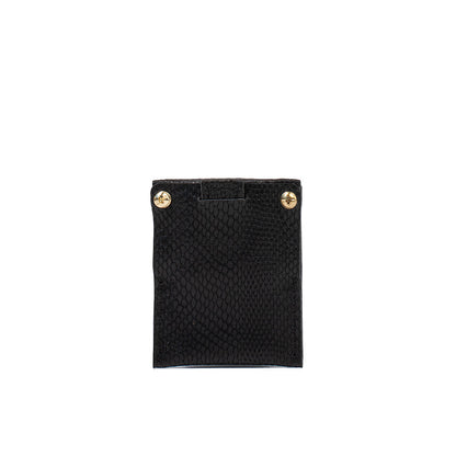 Geometric Goods black snake print leather AirTag card holder with gold rivet details, combining style and security