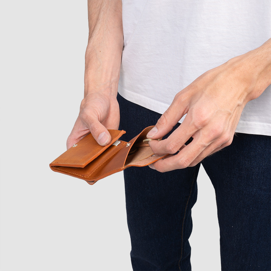 AirTag wallet trifold leather in hands displaying the wallet’s size and functionality