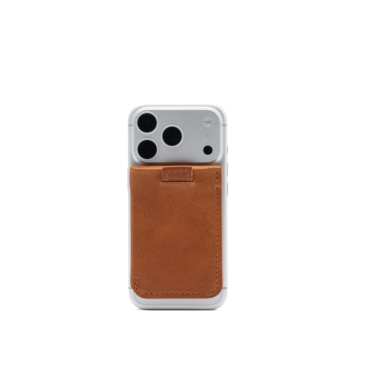 Beige and black leather MagSafe wallet for 4–6 cards attached to the back of a silver iPhone