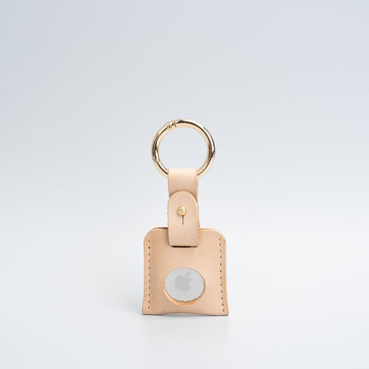 beige leather airtag keyring with golden carabiner