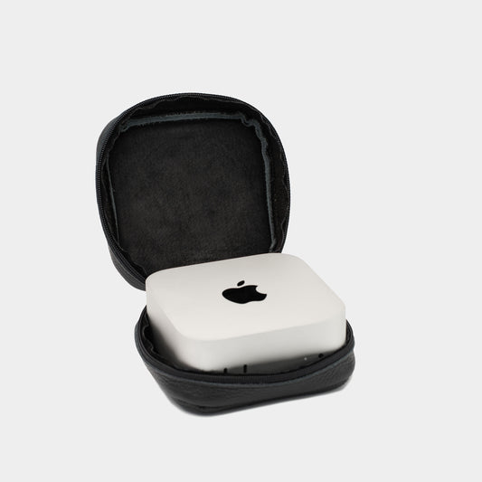 Open black leather Mac Mini case with soft interior lining and Apple Mac Mini placed inside