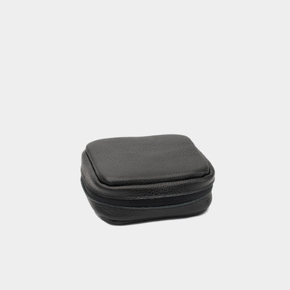 Closed black leather case for Mac Mini with structured shape and zip-around closure