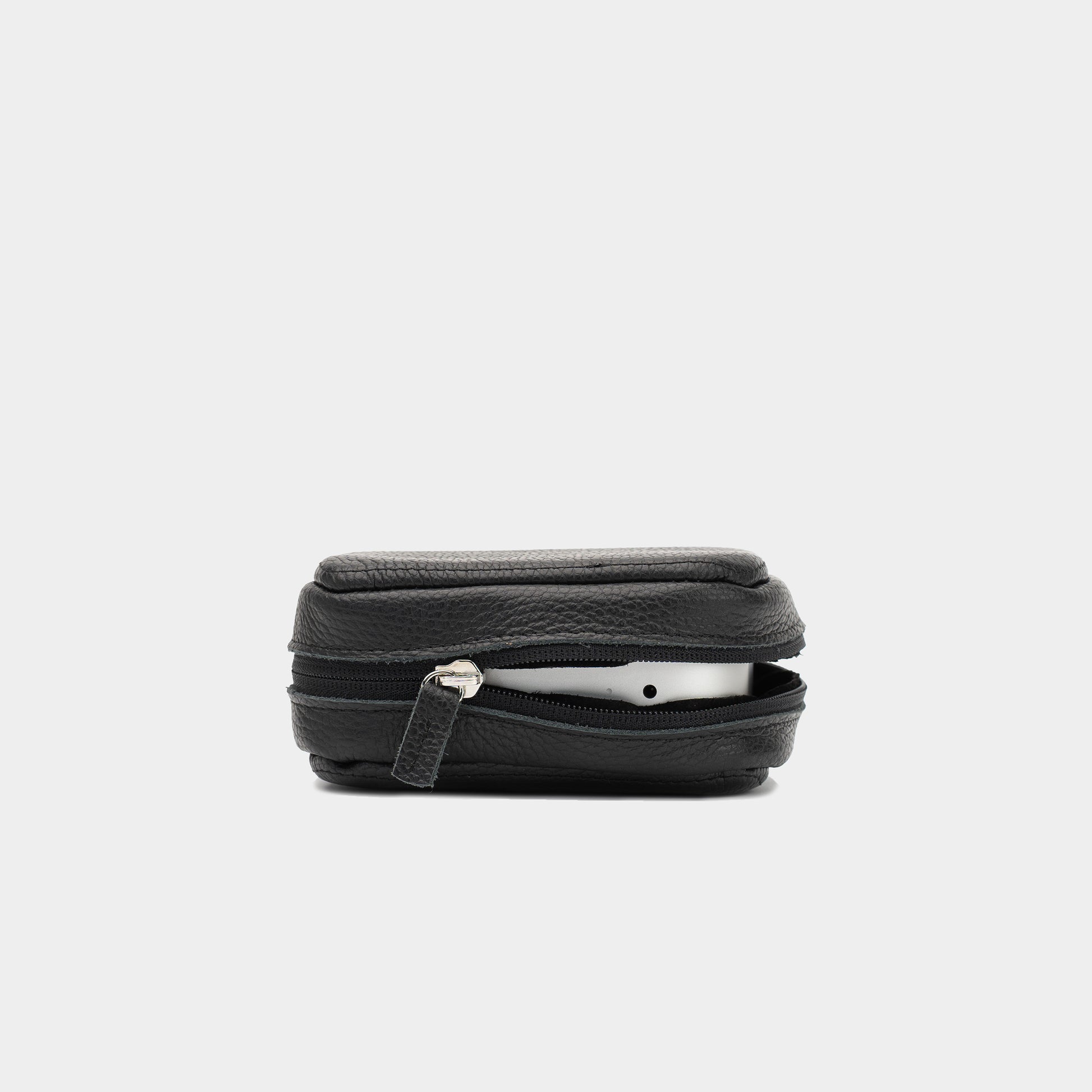 Side view of black Mac Mini leather case partly unzipped with the device visible inside