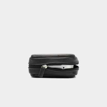 Side view of black Mac Mini leather case partly unzipped with the device visible inside