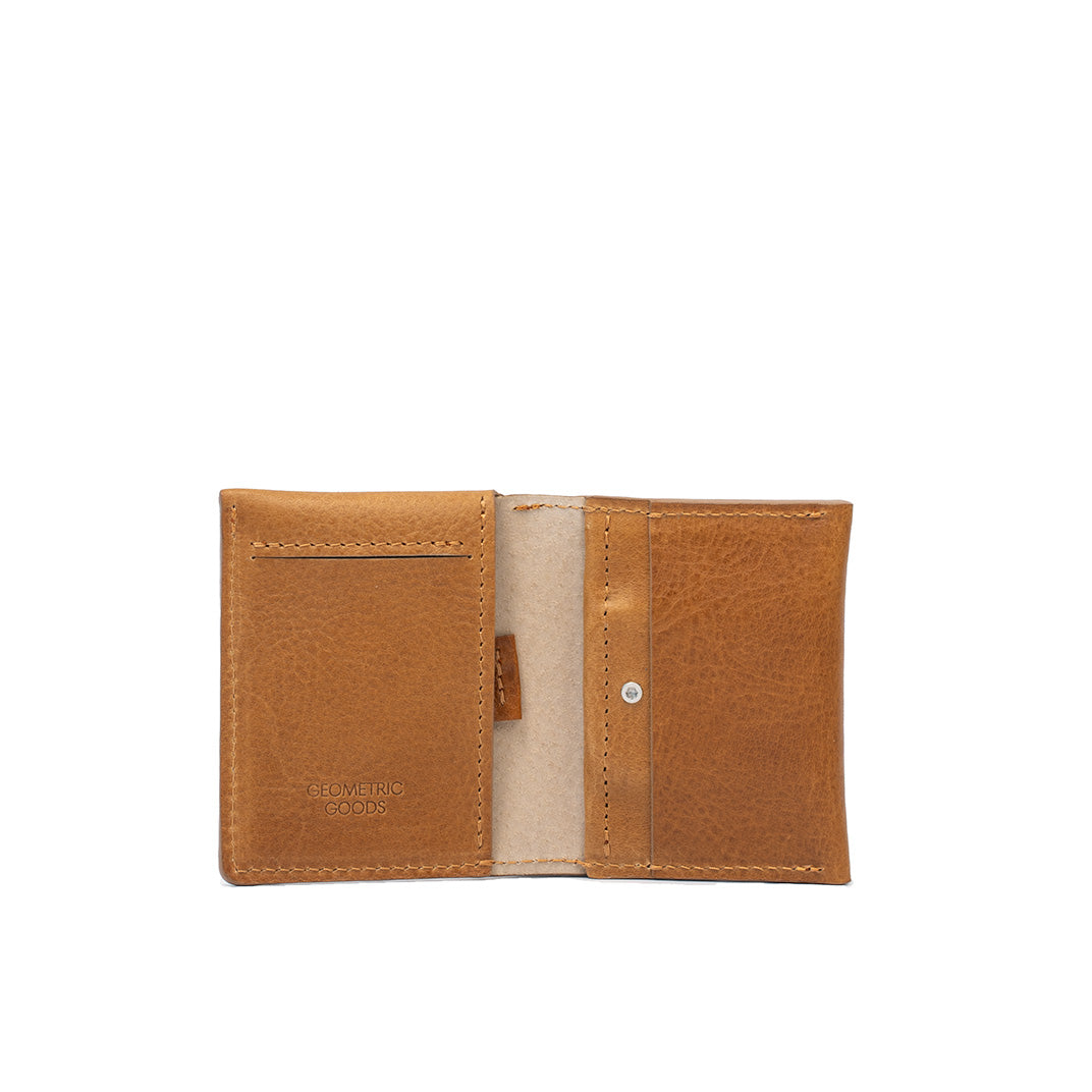 Interior view of camel leather AirTag card wallet showing compartments for cards and cash