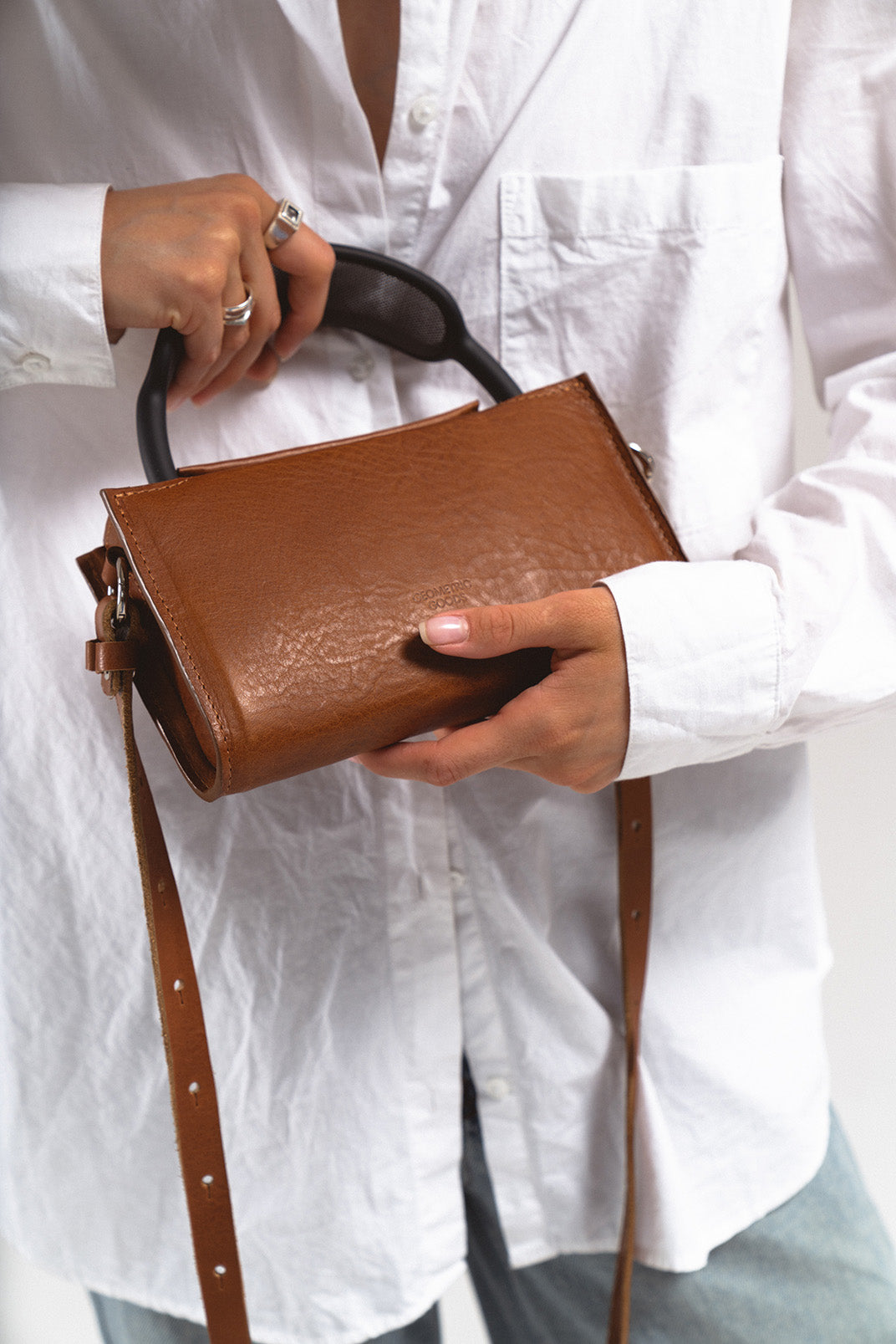 stylish women case for AirPods Max in brown color designed as shoulder bag