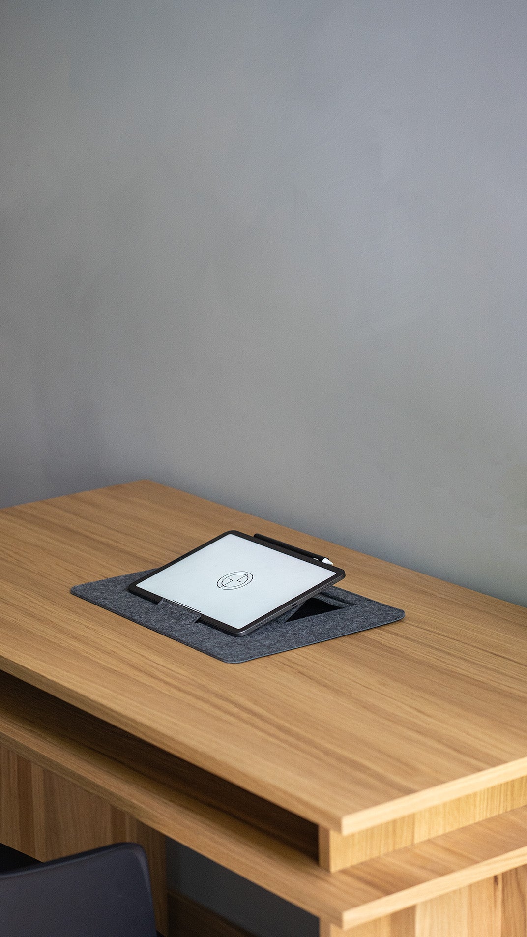 Grey wool felt desk pad with integrated tablet stand