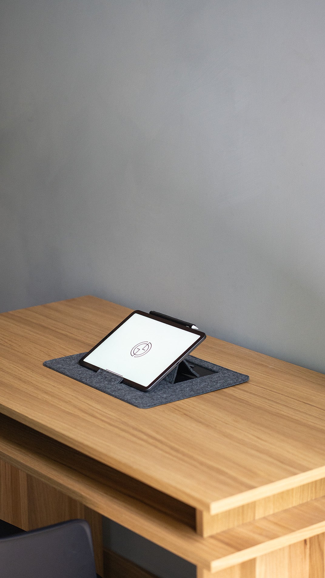desk pad with tablet stand on wooden desk