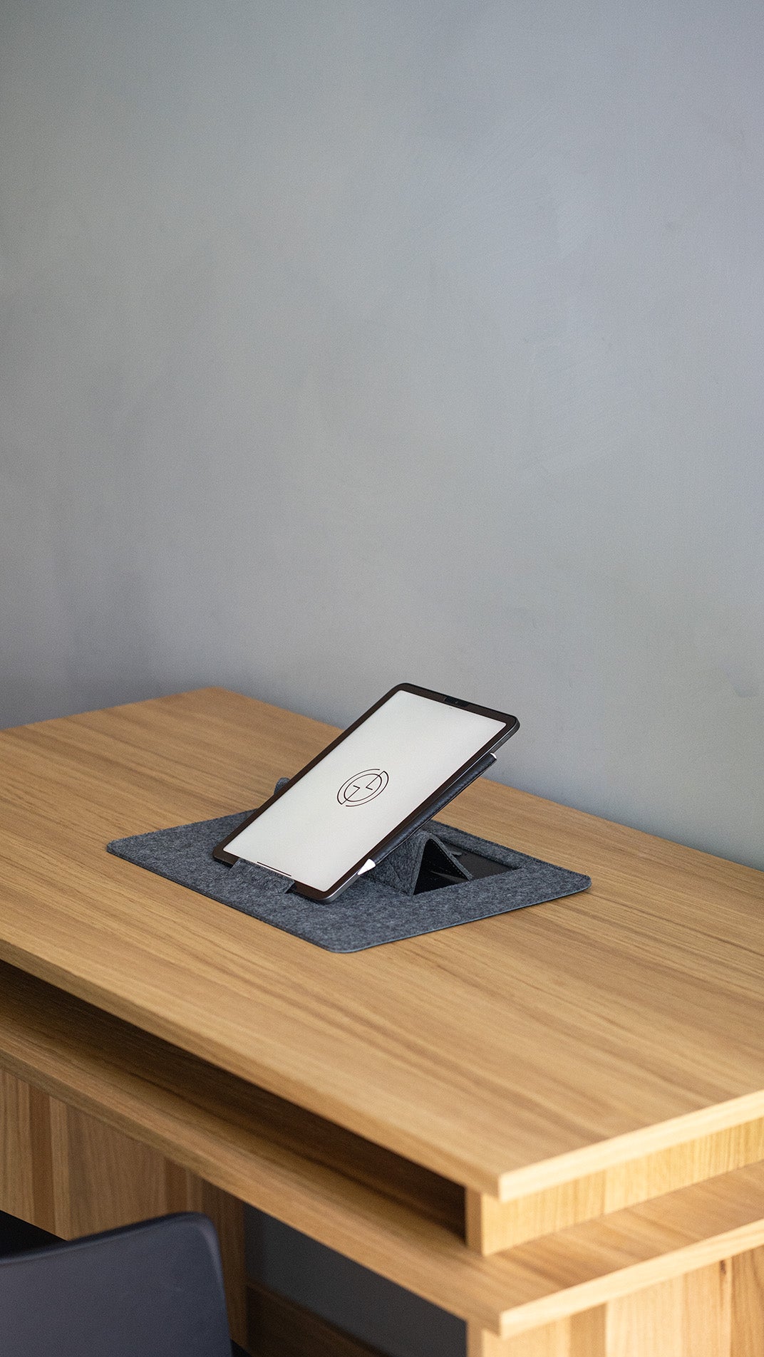 Grey wool felt desk pad with angled tablet stand for drawing or writing