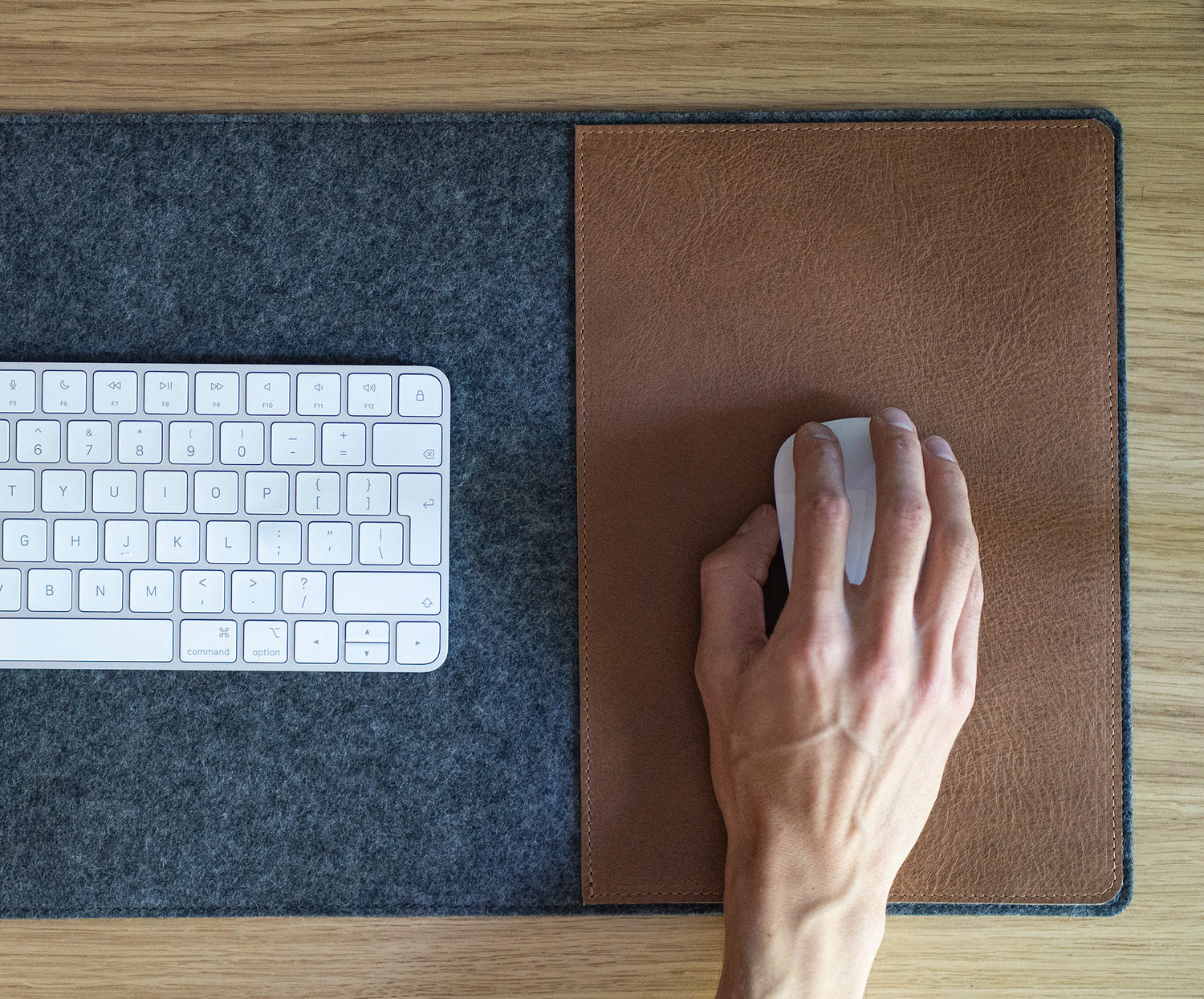 Leather mouse insert on wool felt desk pad for precise cursor tracking