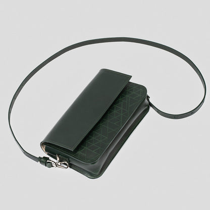 designer dark green shoulder bag with geometric stitching and shiny metallic hardware.