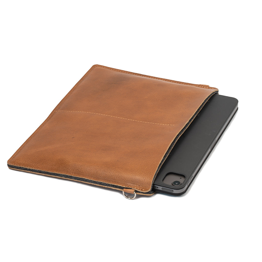 Brown leather tablet sleeve with device partially inserted