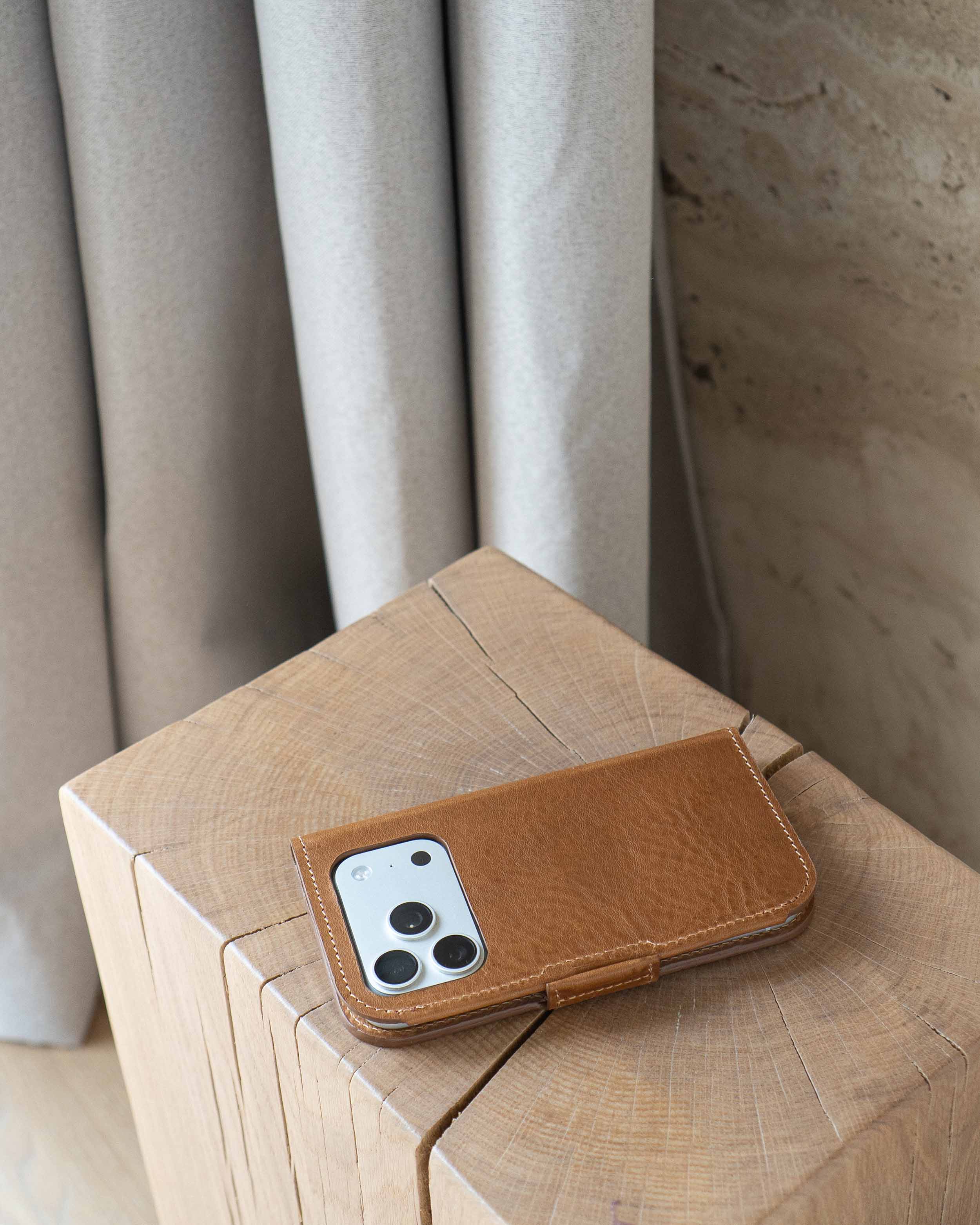 Brown leather iPhone 17 folio wallet case with MagSafe, back view