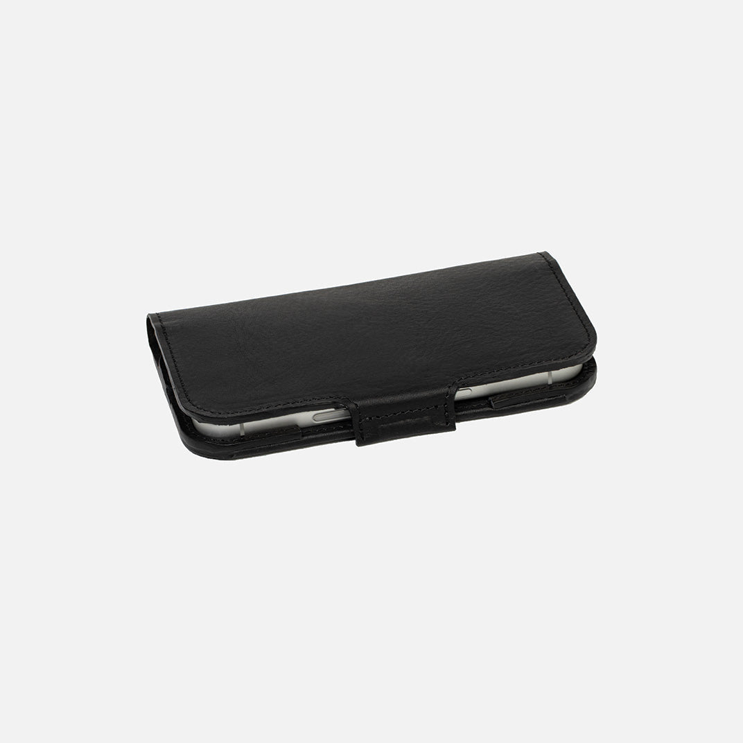 Closed iPhone 17 leather folio wallet case with MagSafe, slim profile with magnetic strap, black Italian leather