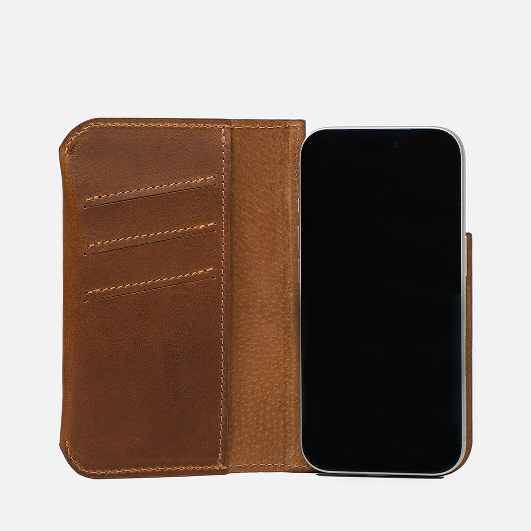 Open brown leather MagSafe folio wallet for iPhone 17 Pro with three card slots and suede lining – Geometric Goods