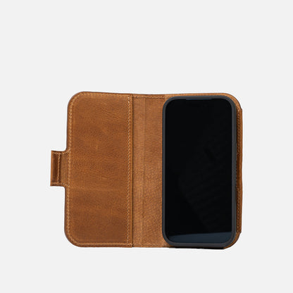 iPhone 17 in open brown leather folio wallet showing interior pocket and tab closure – Geometric Goods
