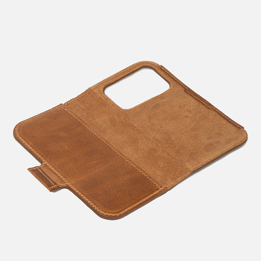 Open brown leather iPhone 17 folio wallet; camera window, card pocket, magnetic tab – Geometric Goods
