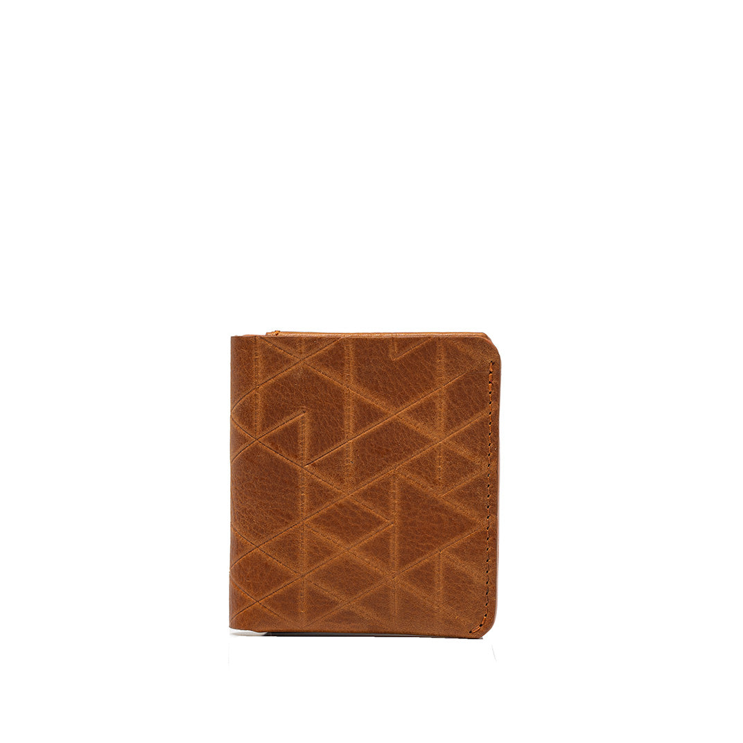 luxury airtag bi-fold wallet made of leather in cognac brown color with geometric pattern