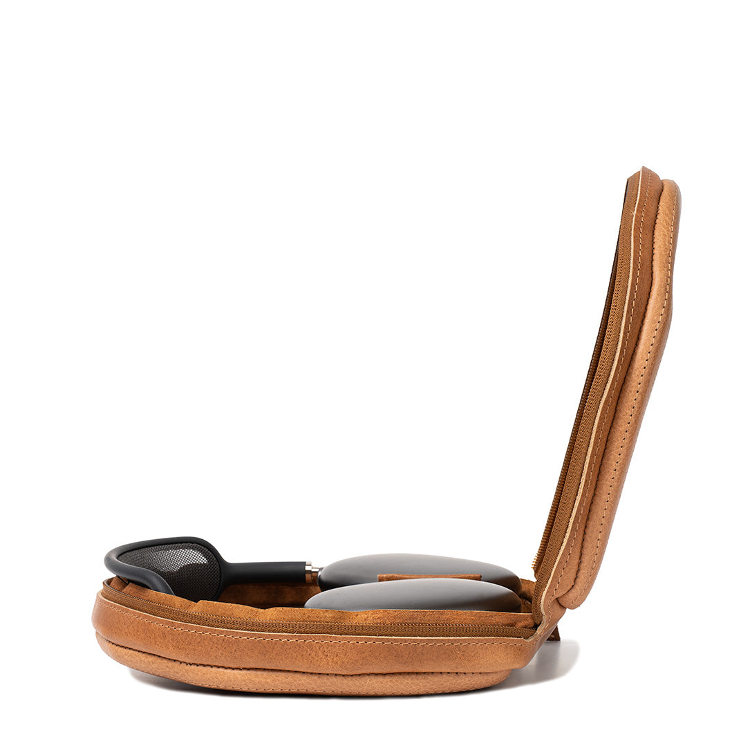 Side view of open brown leather AirPods Max case by Geometric Goods, showing snug fit and structured protective design