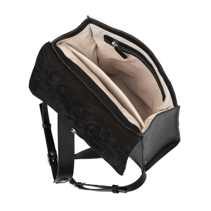 Interior view of the Fibonacci leather backpack showcasing beige cotton lining and multiple pockets for organization