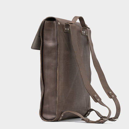 Leather laptop backpack - The Minimalist in gray, side profile view, featuring adjustable straps and premium Italian leather