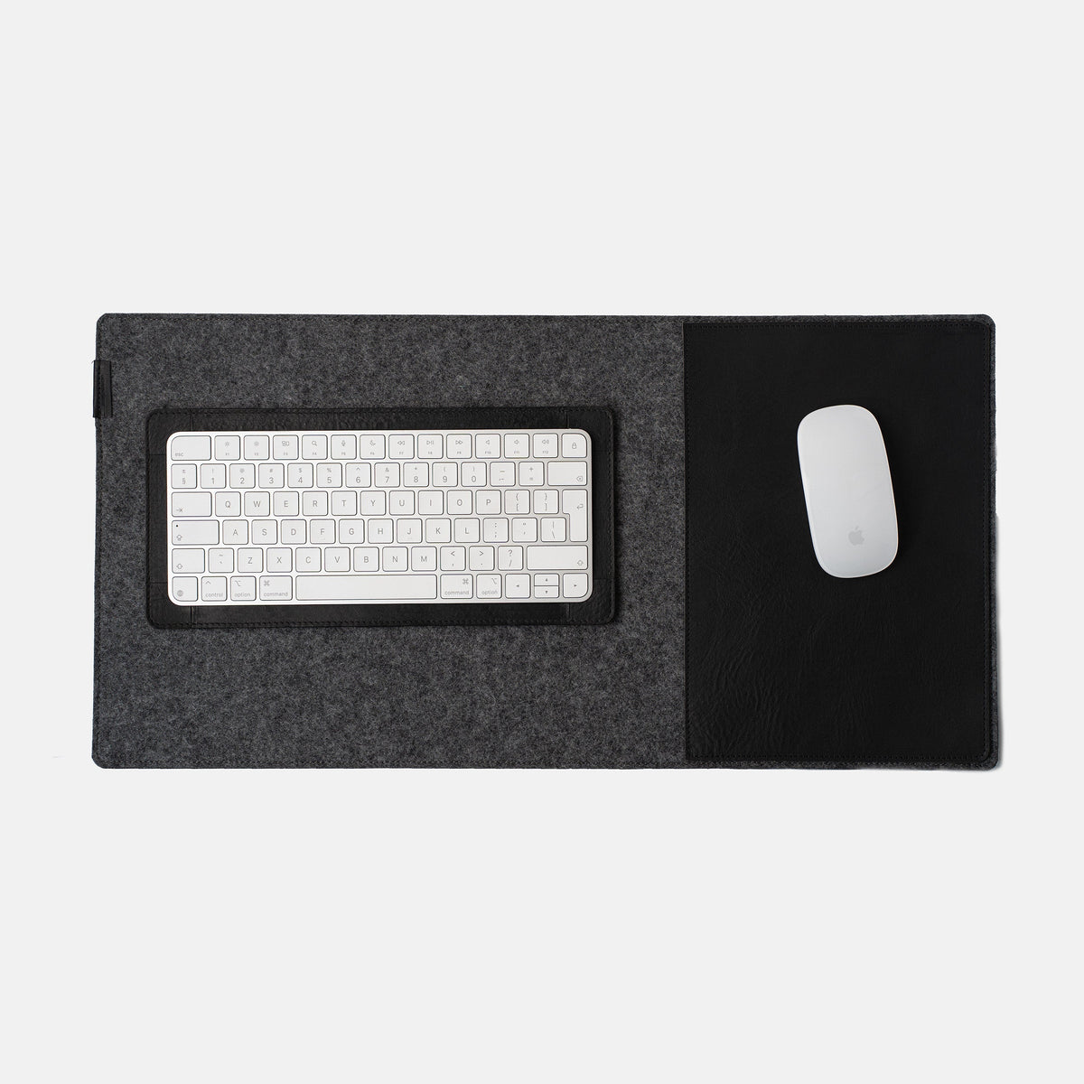 Leather desk setup with full-grain leather desk pad and Magic Keyboard tray