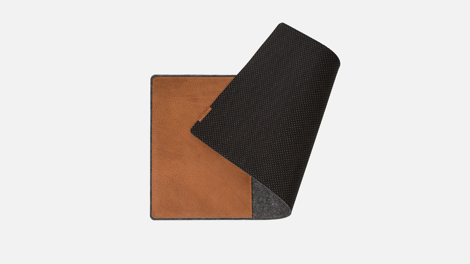 Desk pad with leather surface and non-slip backing for stable desk use