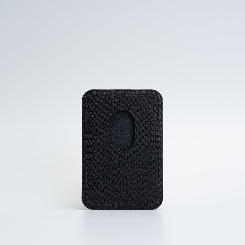 Backside of black leather MagSafe wallet for iPhone with embossed snake print, vegetable-tanned leather