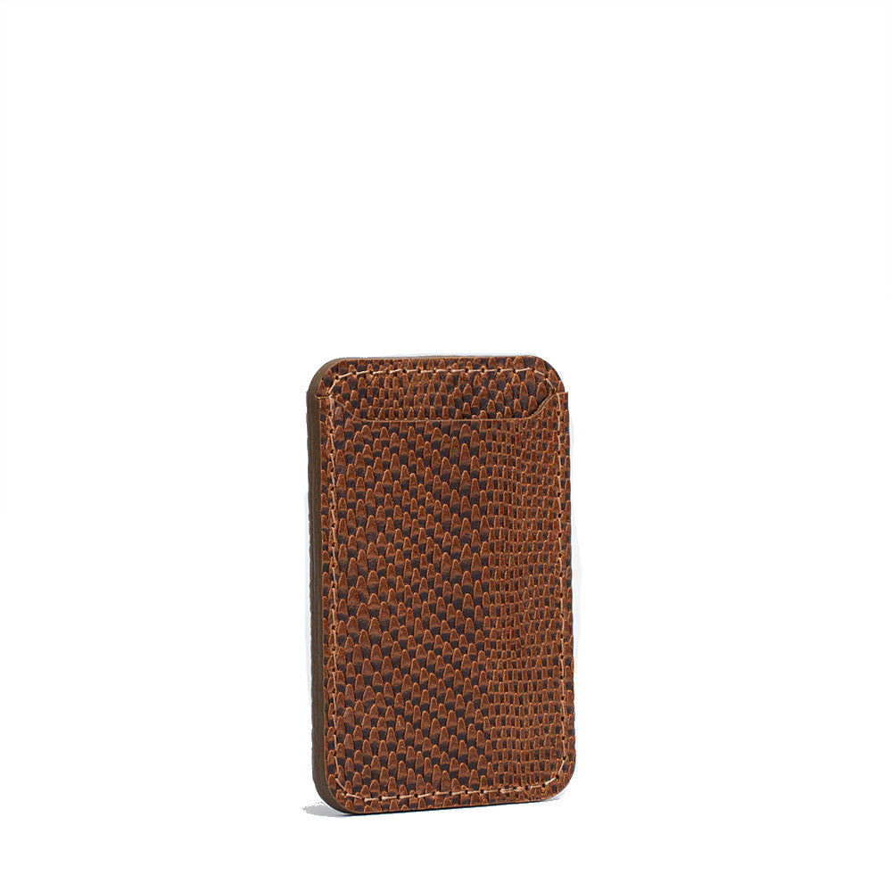 Leather MagSafe wallet for iPhone in brown with embossed snake print design, vegetable-tanned leather, handcrafted, holds 2–3 cards