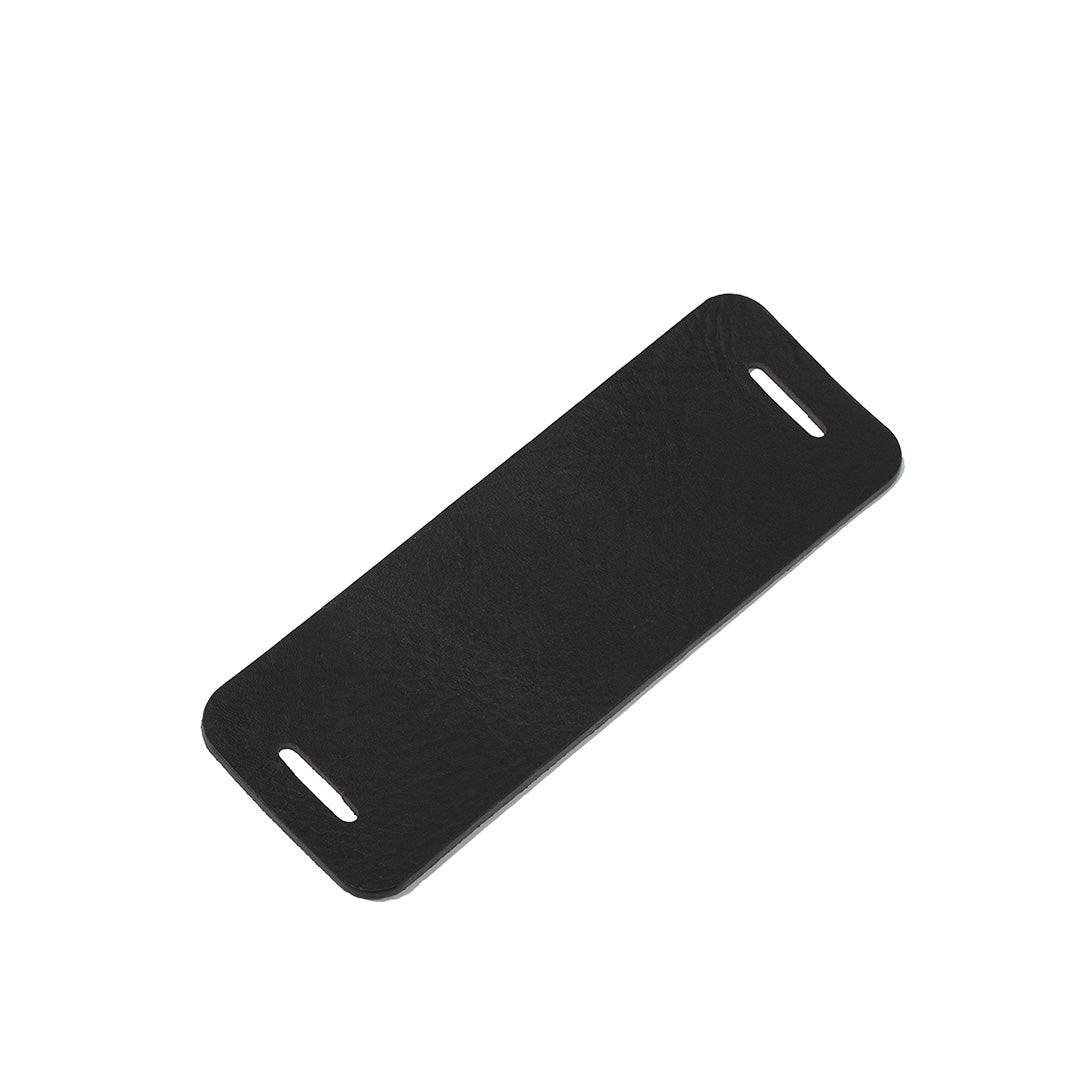 Black leather shoulder pad for bag strap shown flat on white background