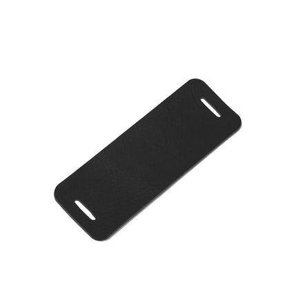 Black leather shoulder pad for bag strap shown flat on white background