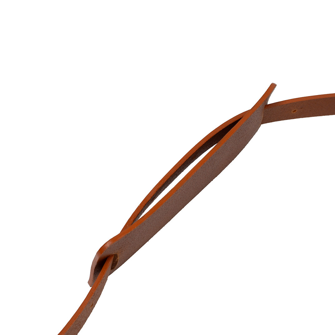 Close-up of leather shoulder pad with strap threaded through the loop