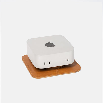 Light brown Italian leather Mac Mini stand called The Pedestal by Geometric Goods, shown with Mac Mini on top