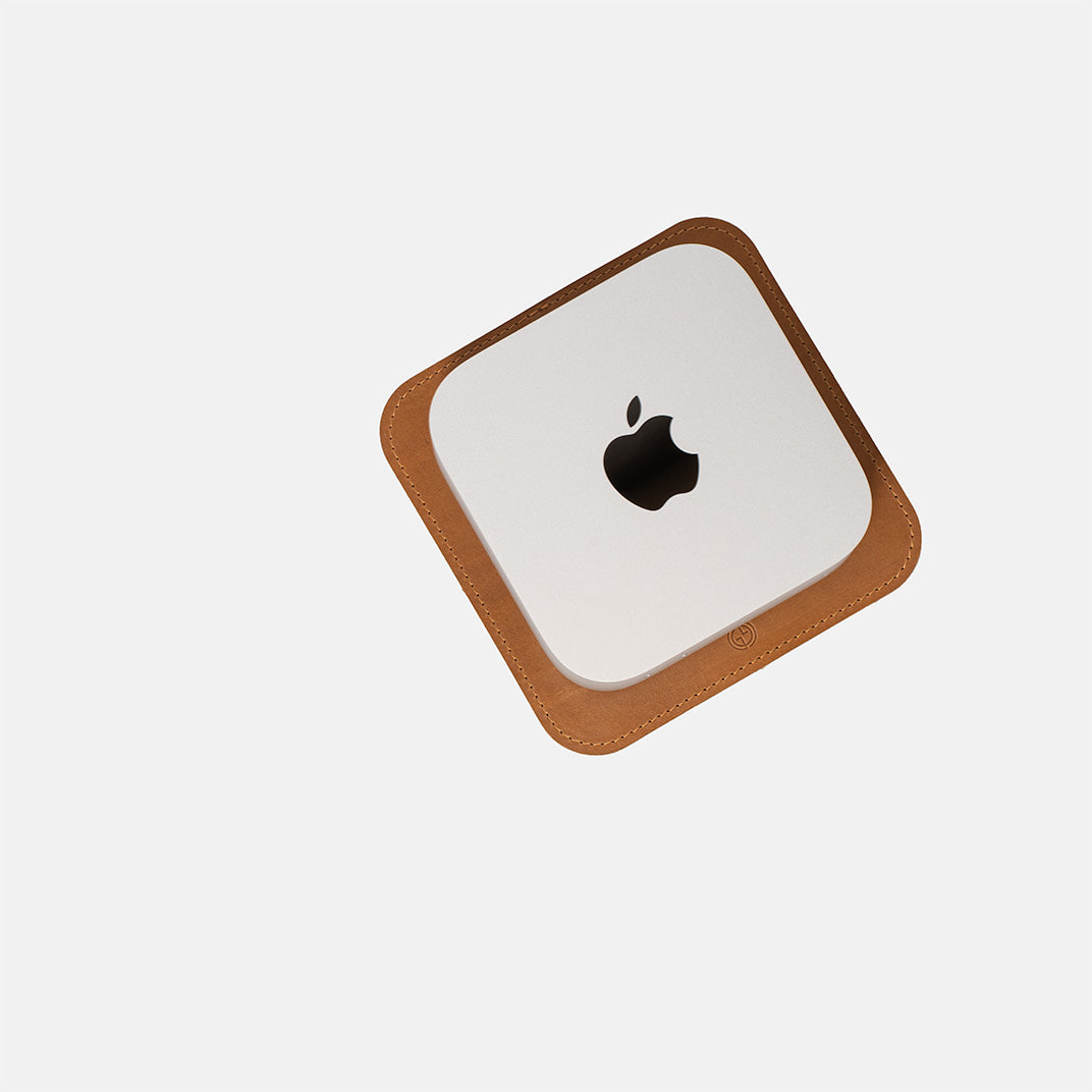Top view of Mac Mini on The Pedestal stand in camel-colored Italian leather by Geometric Goods, showing precise fit and stitching detail