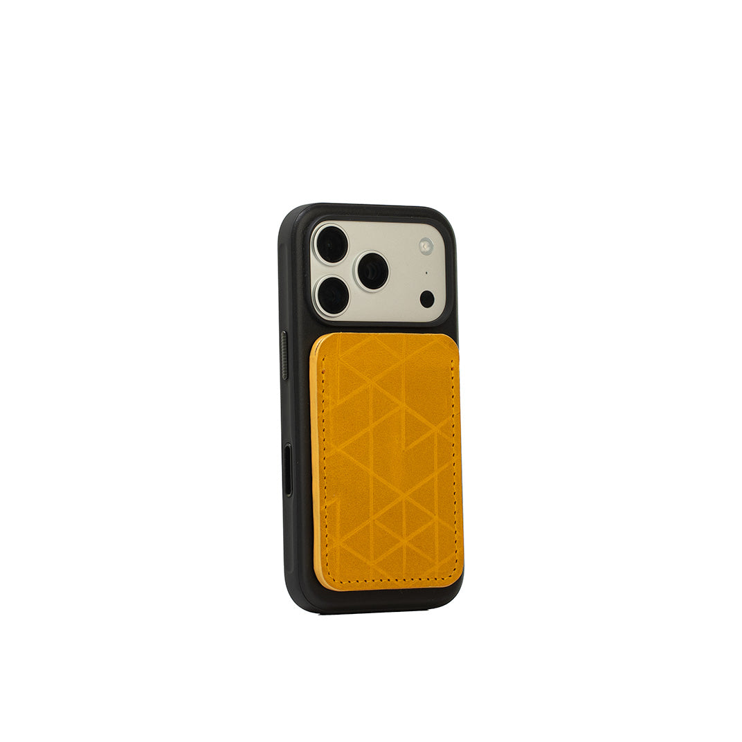 MagSafe leather wallet in Deep Saffron “Vectors” on iPhone with black case — full-grain Italian leather, holds 2–3 cards, Apple-approved strong magnet