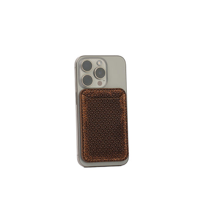 Brown Geometric Net leather MagSafe wallet for iPhone, luxury Italian vegetable-tanned leather with 3D geometric texture, handcrafted, shown on iPhone