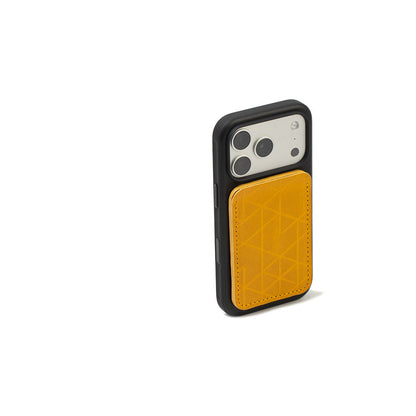 MagSafe leather wallet in Yellow “Vectors” on iPhone with black case — Italian veg-tanned leather, 2–3 card capacity, Apple-approved strong magnet