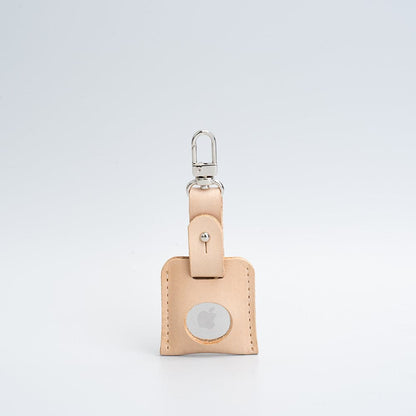 natural beige bag charm with carabiner airtag