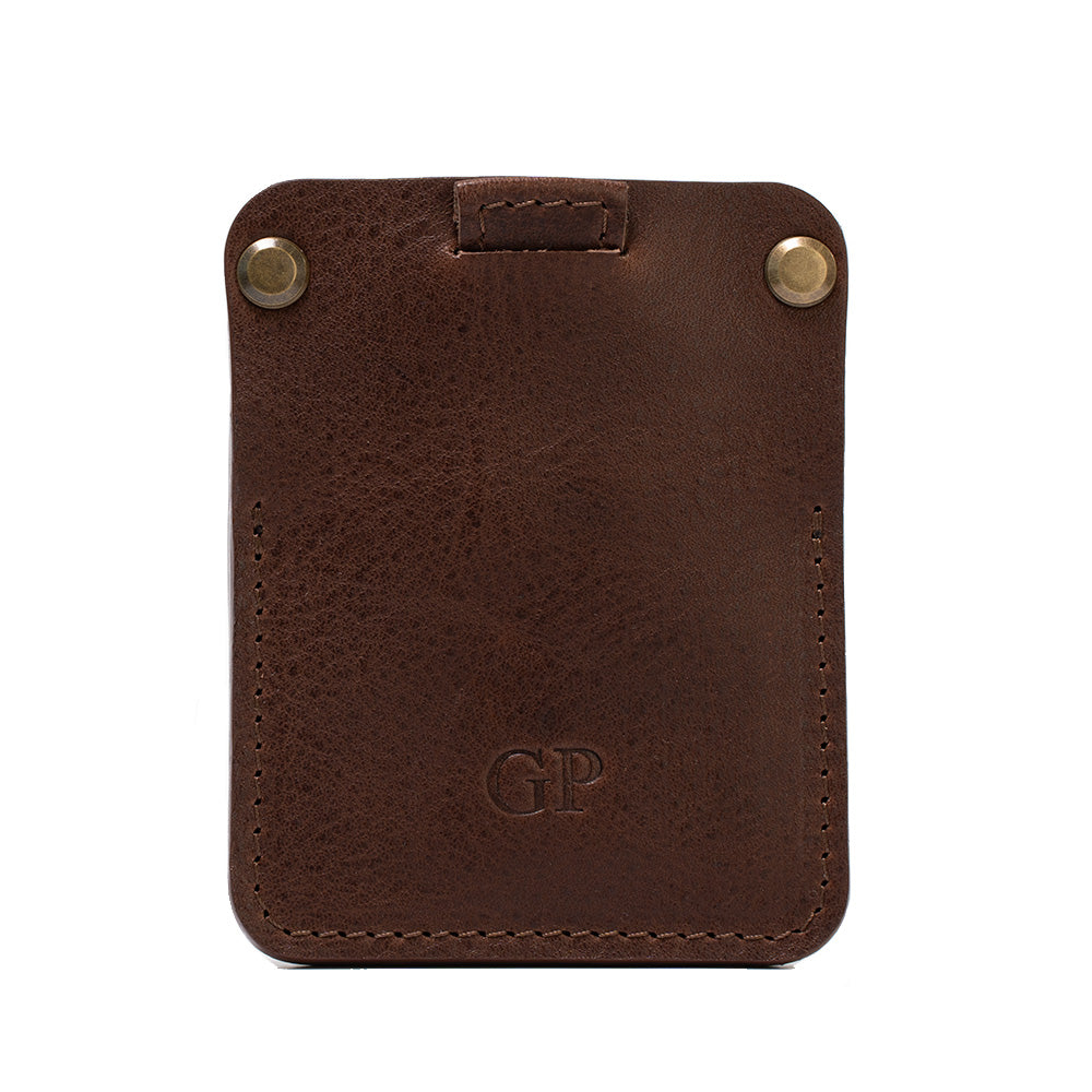 Personalized dark brown leather AirTag wallet with two brass rivets and debossed initials, shown front view on a white background