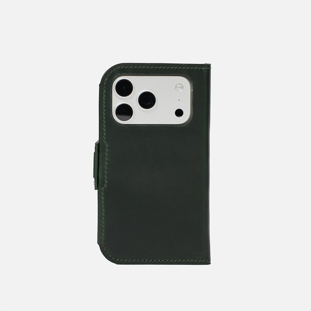 iPhone 17 Pro Max Classic 5.1 leather folio in dark green — closed back view with precise camera cutout and low-profile magnetic strap; full-grain Italian leather, MagSafe-ready