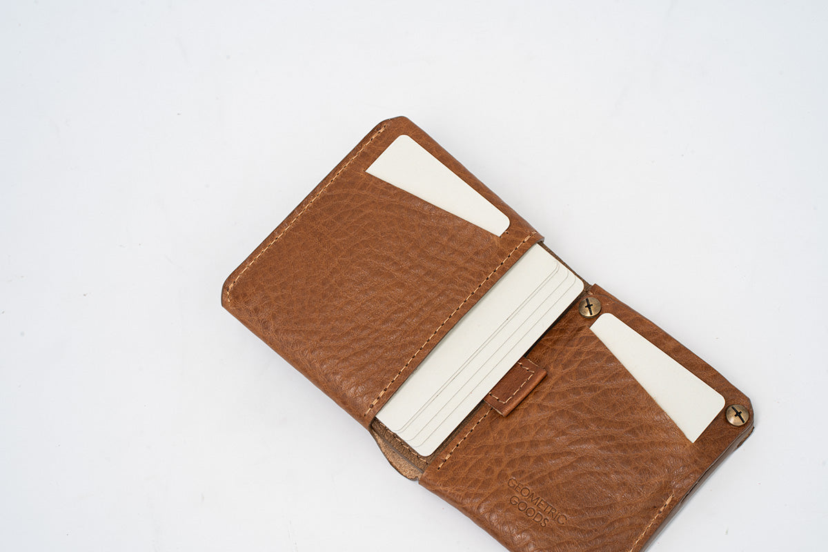 Leather AirTag billfold wallet interior with pull strap for easy card removal